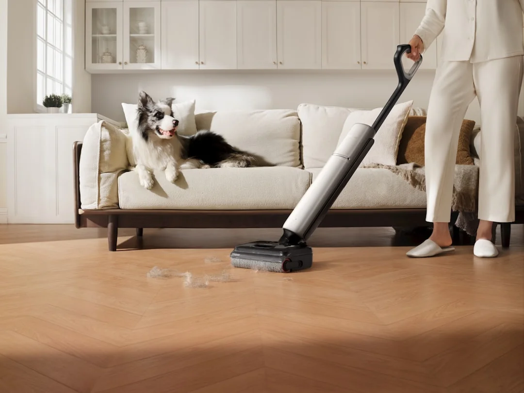 A couple tidying up their living room, organizing furniture and rugs with teamwork.